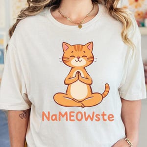 Nameowste Orange CatCat Yoga Pose Unisex Softstyle T-Shirt, Funny Cat Tee, Cat Lover Gift, Yoga Enthusiast Top, Cute Meditation Animal Shirt