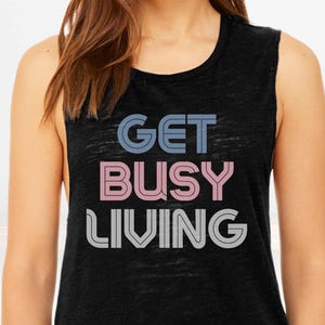 May include: Black sleeveless shirt with the text "GET BUSY LIVING" in a retro font with blue, pink, and white colors.