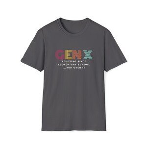 Gildan softstyle tee in Charcoal that says Gen X in colorful large letters over smaller white letters that say Adulting Since Elementary School...and Over It