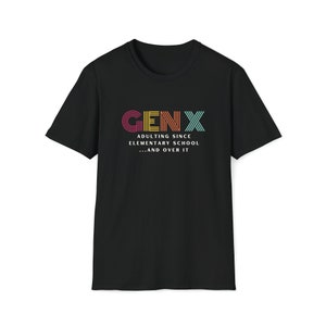 Gildan softstyle tee in Black that says Gen X in colorful large letters over smaller white letters that say Adulting Since Elementary School...and Over It