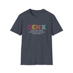 Gildan softstyle tee in Heather Navy blue that says Gen X in colorful large letters over smaller white letters that say Adulting Since Elementary School...and Over It