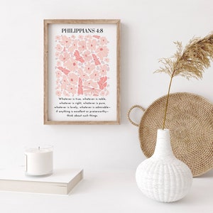 May include: A printable wall art design featuring a pink floral pattern with the text "Philippians 4:8" and the verse "Whatever is true, whatever is noble, whatever is right, whatever is pure, whatever is lovely, whatever is admirable - if anything is excellent or praiseworthy - think about such things."