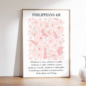 May include: A printable wall art design featuring a pink floral pattern with the Bible verse Philippians 4:8, "Whatever is true, whatever is noble, whatever is right, whatever is pure, whatever is lovely, whatever is admirable - if anything is excellent or praiseworthy - think about such things."