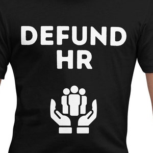 May include: Black t-shirt with white text that reads "DEFUND HR" and a graphic of two hands holding a group of people.