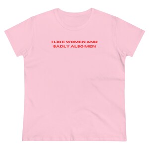 May include: Pink t-shirt with the text "I like women and sadly also men" in red.