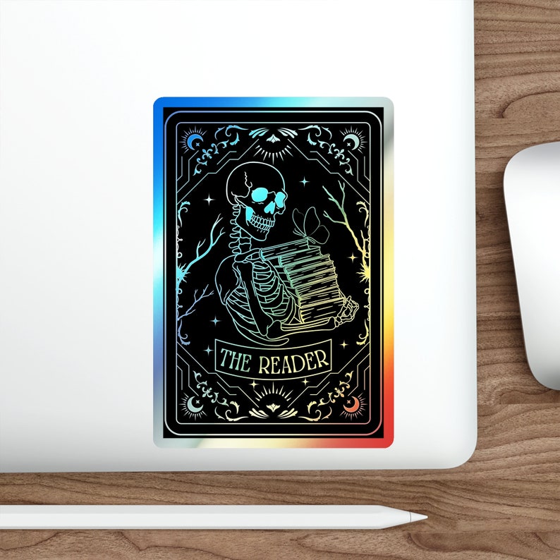 Holographic tarot card sticker featuring a skeleton holding a stack of books with a butterfly atop, surrounded by celestial stars and tree branches. Perfect for laptops, journals, water bottles, and scrapbooks. Ideal gift for readers and book lovers.