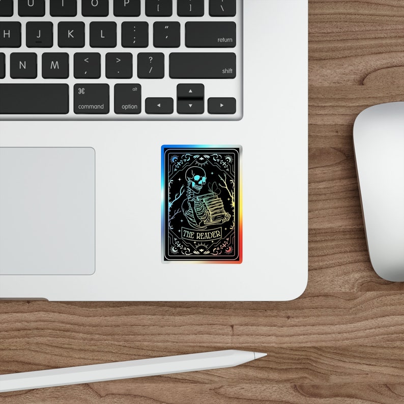Holographic tarot card sticker featuring a skeleton holding a stack of books with a butterfly atop, surrounded by celestial stars and tree branches. Perfect for laptops, journals, water bottles, and scrapbooks. Ideal gift for readers and book lovers.