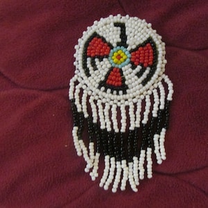 beaded thunderbird pin
