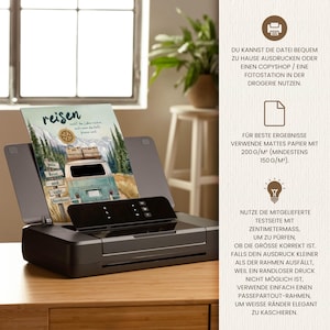 May include: A black printer holding a printed sheet featuring a watercolour illustration of a vintage van, mountains, and a compass. The text reads "reisen", "gute Reise und viele Abenteuer". The right side displays German instructions for printing.