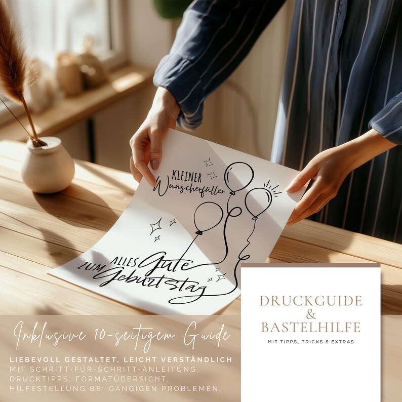 May include: A person holding a white card with black script and balloon illustrations. The card reads "Alles Gute zum Geburtstag" and "Kleiner Wunschf&uuml;ller". A second card reads "Druckguide & Bastelhilfe".