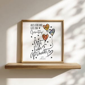 May include: A framed print with the text "Alles Liebe und Gute zum Geburtstag!" and "Mit Liebe geschenkt". The print features three colorful balloons with the numbers 10, 20, and 60. Black hearts are scattered around the text and balloons.