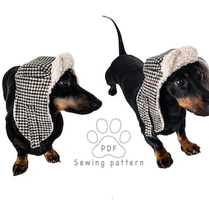 Könnte beinhalten: Zwei schwarz-braune Dackel tragen Trappermützen mit Hahnentrittmuster und cremefarbenem Kunstfellfutter. Zwischen den Hunden befindet sich ein Pfotenabdruck-Symbol mit dem Text PDF und darunter Sewing pattern. Der Markenname PawerPrint ist sichtbar.