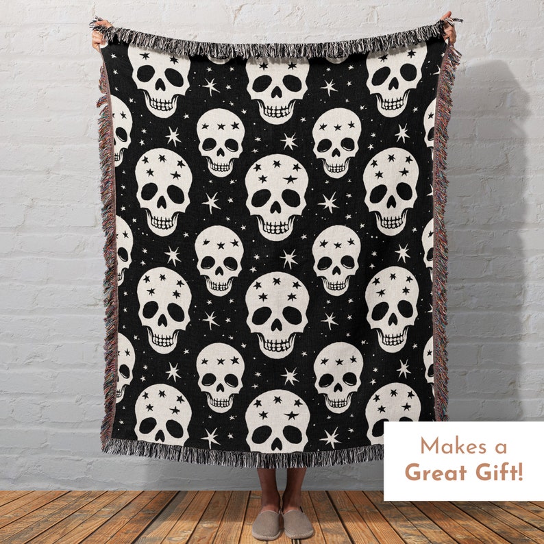 May include: Black and white woven throw blanket with a skull and star pattern. The blanket has a fringed edge. Makes a Great Gift!
