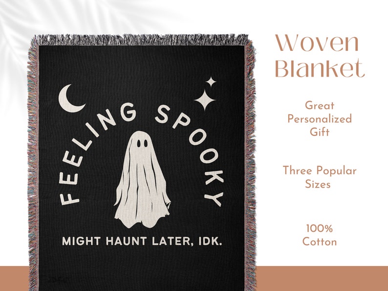 May include: A black woven blanket with fringed edges featuring a white ghost graphic, a crescent moon, and a four-pointed star. The text reads "FEELING SPOOKY" in an arc above the ghost and "MIGHT HAUNT LATER, IDK." in a straight line below.