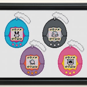 May include: Four colourful Tamagotchi toys, each with a different character on the screen. The toys are blue, grey, purple, and pink.