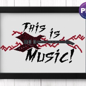 May include: Framed cross-stitch pattern with a black border. The design shows a black guitar with red detailing and the words "This is Music!" in a bold font. A PDF download is available.