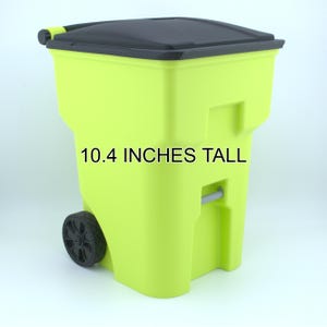 May include: A lime green rolling container with a black lid and a handle. The container is 10.4 inches tall. The container has a wheel on the side for easy transport. The text "10.4 INCHES TALL" is printed on the front.