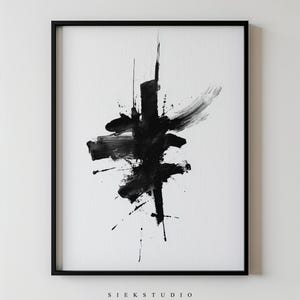 May include: Abstract black ink painting on white paper, framed in a black border. The artwork features bold brushstrokes and splatters, creating a dynamic and expressive composition. The text "SIEK STUDIO" is printed at the bottom.