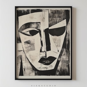 Puede incluir: Lámina de arte abstracto en blanco y negro que representa un rostro con formas geométricas. La obra presenta líneas audaces y un aspecto texturizado, enmarcada en un marco negro. El texto "SIEK STUDIO" está impreso en la parte inferior.