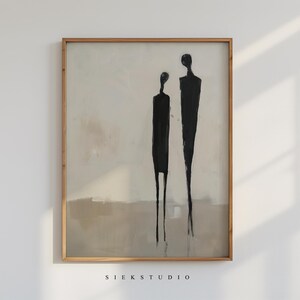 May include: Abstract painting of two figures in black against a light beige background. The figures are stylized and elongated, with simple lines and shapes. The painting is framed in a light wood frame.