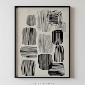 May include: Framed abstract art print in black, featuring black and white rectangular shapes with vertical and horizontal lines. The text "SIEK STUDIO" is printed at the bottom of the artwork.