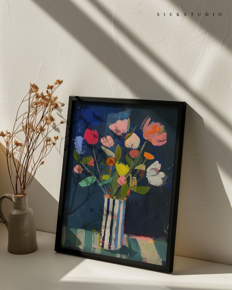 May include: A framed painting of a colorful bouquet of flowers in a striped vase. The flowers are pink, yellow, orange, red, and white. The background is a dark blue.