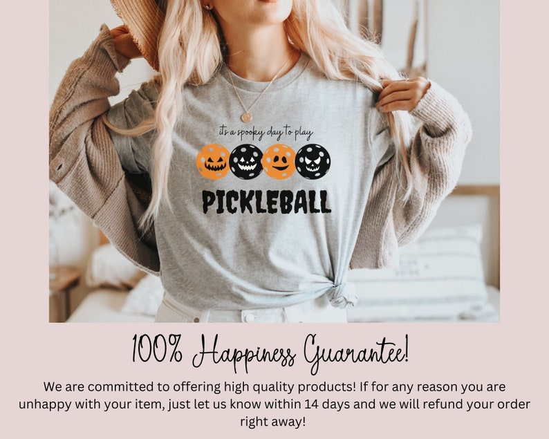 May include: A gray t-shirt with a black and orange pumpkin design and the text "It's a spooky day to play Pickleball".
