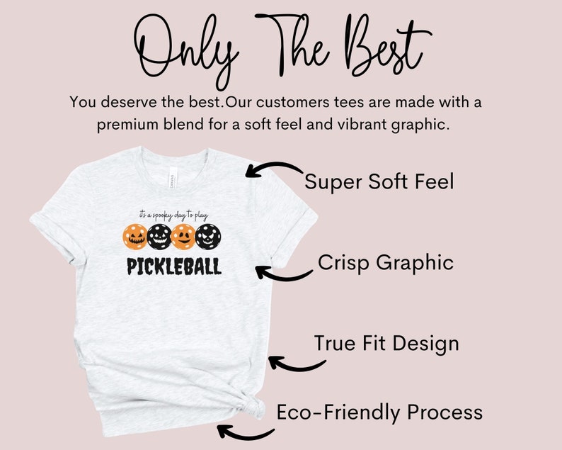 May include: A heather grey t-shirt with a black and orange pumpkin graphic and the text "It's a spooky day to play PICKLEBALL". The shirt is made with a soft, premium blend and features a crisp graphic, true fit design, and eco-friendly process.