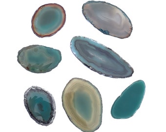 May include: Assortment of seven agate slices in various shades of green and brown. The slices are smooth and polished, with natural patterns and textures.