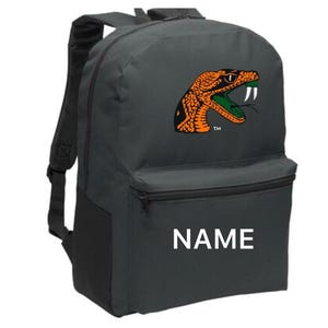 May include: A gray canvas backpack with a black snake head logo and the word "NAME" printed on the front.