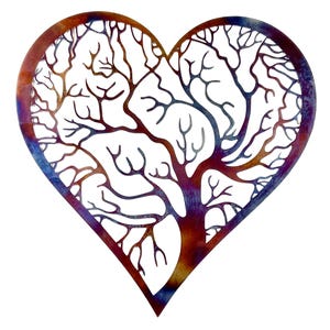 May include: A metal heart-shaped wall art with a tree design inside. The heart is painted in shades of red, orange, purple, and blue.