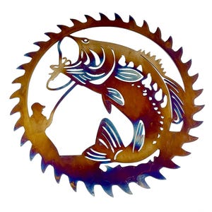 May include: A metal wall art sculpture of a bass fish jumping out of the water with a fisherman in the background. The sculpture is shaped like a saw blade and has a rustic, iridescent finish.