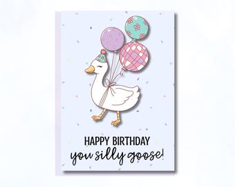 May include: A birthday card with a cartoon goose wearing a party hat and holding balloons. The card has the text "HAPPY BIRTHDAY you silly goose!" on a light blue background with confetti.