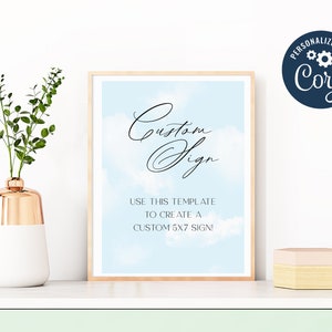 May include: A printable sign template with a blue sky and white clouds background. The text on the sign reads "Custom Sign" and "Use this template to create a custom 5x7 sign!"