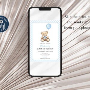 May include: A blue and white digital invitation with a teddy bear holding a blue balloon. The invitation says "Join us to celebrate Michael's Dearly 1st Birthday!"