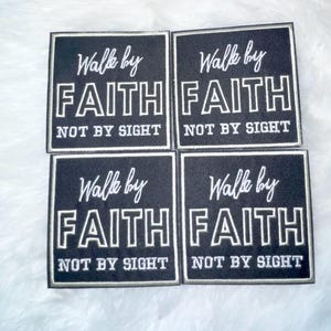 May include: Four square black patches with white embroidered text. Each patch reads "Walk by FAITH NOT BY SIGHT" in a stylized font. The patches are arranged in a 2x2 grid, with a white fluffy background.
