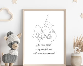 May include: A framed print featuring a minimalist line drawing of an angel holding a baby. The artwork is in black on a white background, with the text "You never arrived in my arms, but you will never leave my heart."