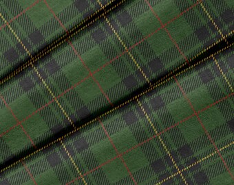 May include: Green, black, red, and yellow plaid fabric with a woven texture.