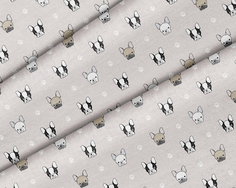 May include: A gray fabric with a repeating pattern of white paw prints and black and brown French bulldog faces.