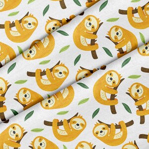 May include: White fabric with a repeating pattern of cartoon sloths hanging from brown branches. The sloths are yellow and have smiling faces. Green leaves are scattered throughout the design. This fabric is suitable for various sewing projects.