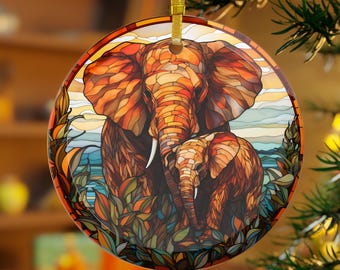 May include: A stained glass ornament featuring a mother elephant and her baby elephant. The elephants are depicted in shades of orange, brown, and yellow, with a blue and green background.