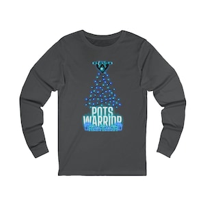 May include: Dark gray long-sleeve shirt with a graphic of a Christmas tree made of blue lights. The words "POTS WARRIOR" are displayed in white and blue. The shirt is made of a soft material.