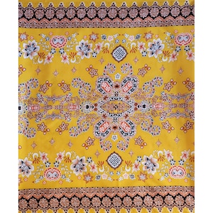 May include: Yellow fabric with a floral and paisley pattern. The fabric has a black, orange, and white design.