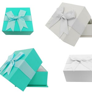Puede incluir: Se muestran cuatro cajas de regalo. Dos son de color turquesa con cinta y lazo a juego, las otras dos son blancas con cinta y lazo plateados. Una caja turquesa est&aacute; abierta, revelando un interior blanco. Una caja blanca est&aacute; abierta.