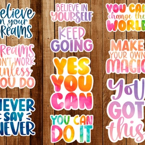 May include: A set of 10 colorful motivational stickers with inspirational quotes. The stickers feature a watercolor-like design with a white border. The quotes include "Believe in Yourself", "Keep Going", "You Can Change the World", "Make Your Own Magic", "Yes You Can", "You Got This", "Believe in Your Dreams", "Dreams Don't Work Unless You Do", "Never Say Never", and "You Can Do It".