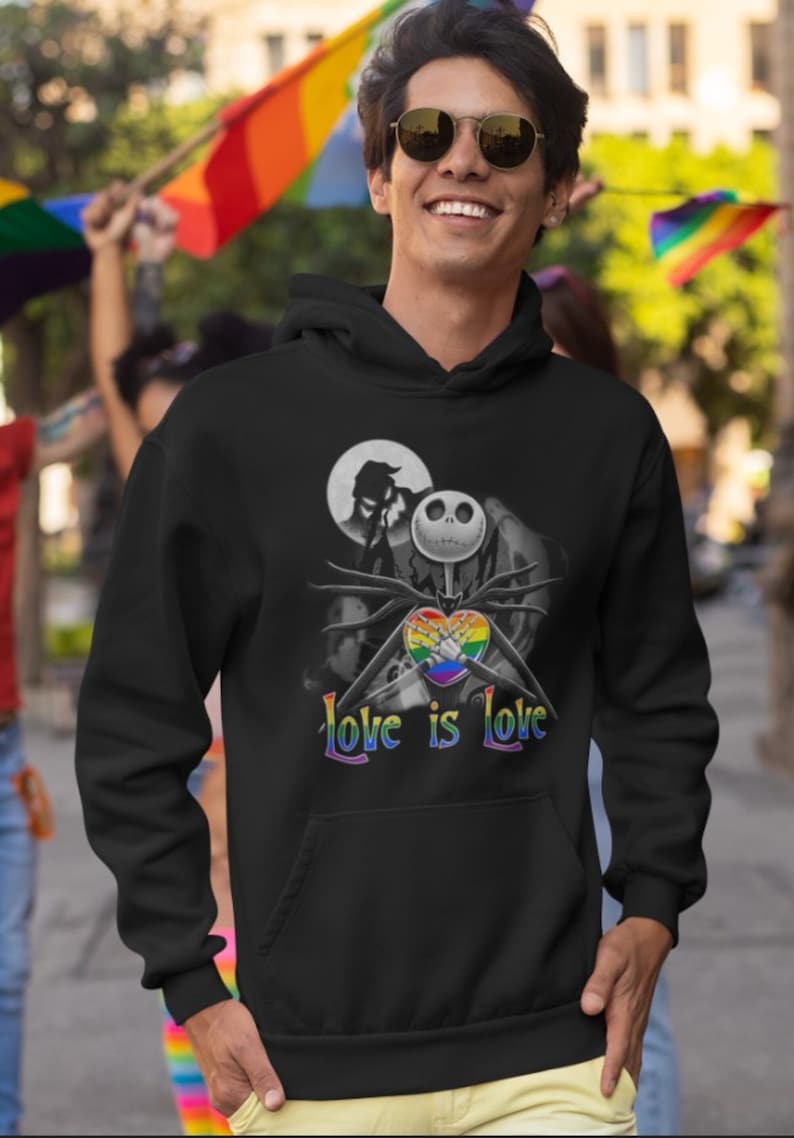 May include: Black hooded sweatshirt with a graphic of Jack Skellington from The Nightmare Before Christmas holding a rainbow heart with the text "Love is Love".
