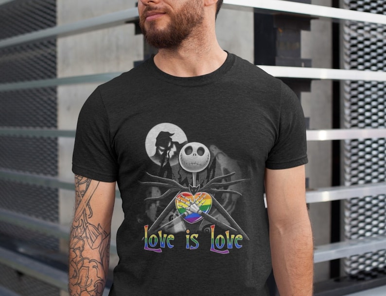 May include: Black t-shirt with a graphic of Jack Skellington from The Nightmare Before Christmas holding a rainbow heart. The text "Love is Love" is printed below the graphic.