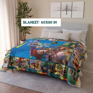 May include: A blue blanket featuring characters from the animated film "Toy Story." The blanket measures 60 x 80 inches and has a border with the words "Toy Story." The blanket is spread over a bed with white pillows.