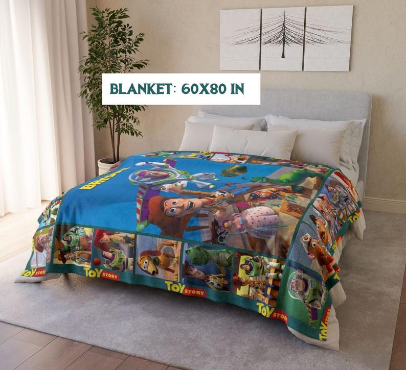 May include: A blue blanket featuring characters from the animated film "Toy Story." The blanket measures 60 x 80 inches and has a border with the words "Toy Story." The blanket is spread over a bed with white pillows.