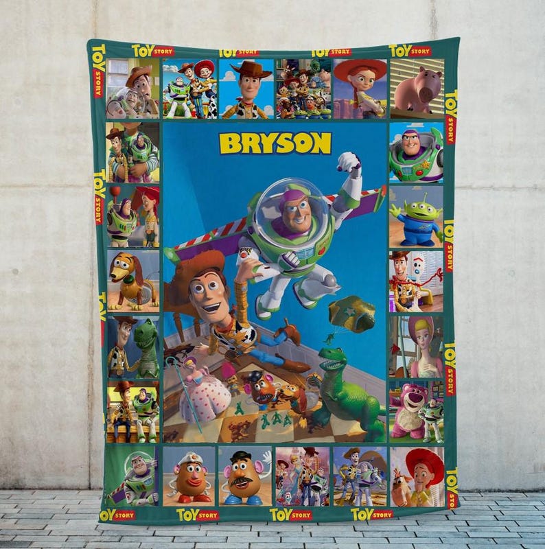 May include: A personalized fleece blanket featuring characters from the animated film "Toy Story." The blanket has a teal border with character images and the text "TOY STORY." The center features Buzz Lightyear and the name "BRYSON" on a blue background.